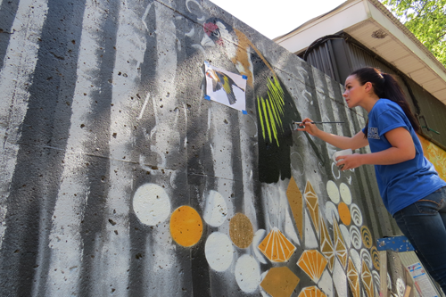 Lewiston-Porter High School junior Olivia Carney served as artist Chuck Tingley's student assistant.