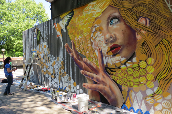 Lewiston-Porter High School junior Olivia Carney served as artist Chuck Tingley's student assistant.