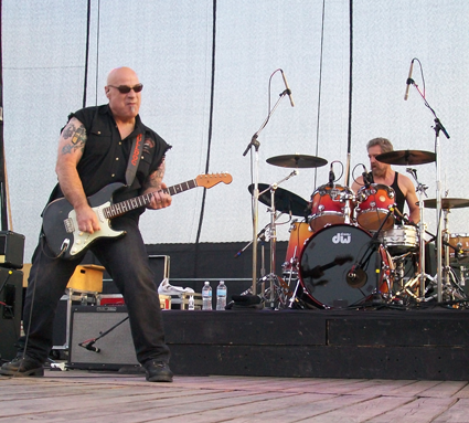 Revisited lead singer John Tristao with "Cosmo."