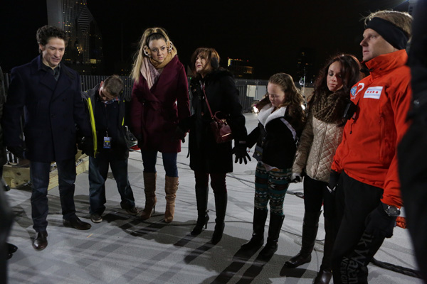 Nik Wallenda and his family pray with Pastor Joel Osteen prior to Nik's two highwire walks Sunday.