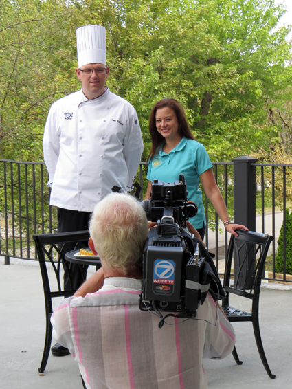 Wegmans (Military Road) event coordinator Jill Feistel and chef Jamie Walkowiak prepare for their time on camera. Below, Walkowiak holds a delicious dish.