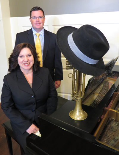 At the piano, from left - from M&T Bank - are Lucy Muto and Josh Heim.