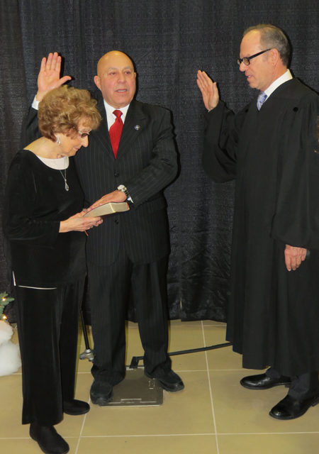 Former North Tonawanda City Judge Joseph Cassata performed the ceremony, as Morinello's mother, Mary Certo-Rolle, held the Bible.