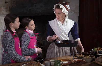 Emerson shares some cooking tips with the girls.