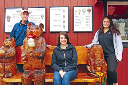 Pictured, from left, along with the famous Silo bears outside the caboose, are Alan Hastings, Stacey Sheehan and Lexi Alfiere 