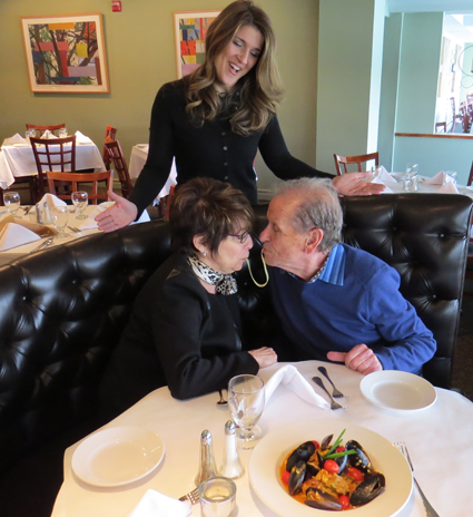 Jacqueline DiBernardo watches as Carol Calato and Richard Soluri pose for a playful photo at Water Street Landing.