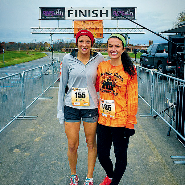 Senior Kyra Johanson took top honors as the fastest Lew-Port female athlete. She is shown with race organizer Katie Beatty following the race. (Contributed photo)