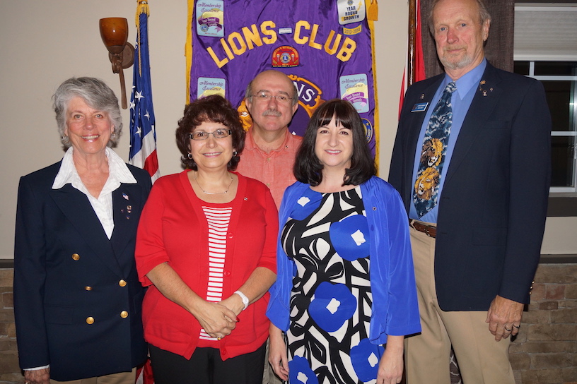 The Crafts flank the new members.