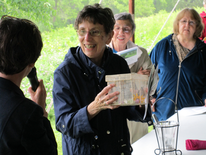 Sr. Edith accepting a gift of butterflies.