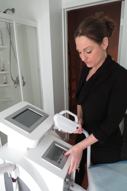 Tuscana Salon & Spa owner Jillian Zaccarella with her YAG laser.