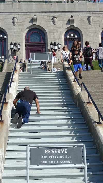 Dr. Jafari climbing the stairs on his knees at St. Joseph's in Montreal.