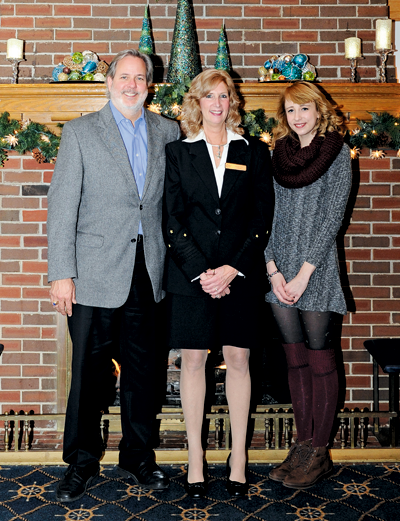 Newly elected Buffalo Launch Club Commodore Rhonda Ried, center, is flanked by her husband, Gregory, and their daughter, Amber, at the BLC. (Photo by K&D Action Photo & Aerial Imaging)