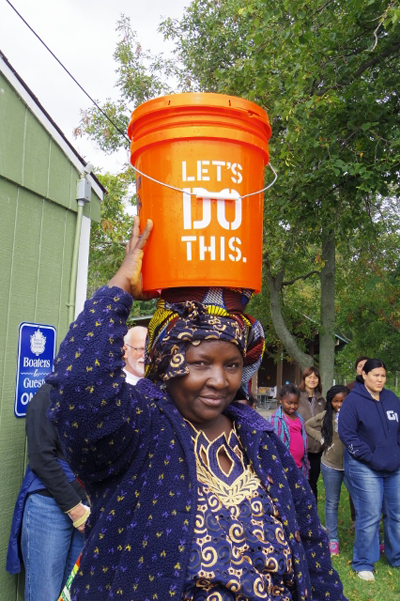 Marie Edonyemya offered a visual demonstration of life in many parts of Africa and Asia, where women regularly walk long distances, carrying the water on their heads that their families need for cooking and drinking. Edonyemya and her husband, Byaombe Shabani, are from the Congo and have lived in Buffalo for six years.