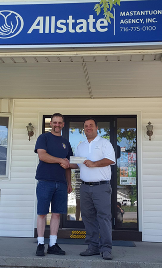Grand Island Fire Chief Matt Osinski, left, receives a check from Allstate agent Phil Mastantuono. (Photo courtesy of Allstate)