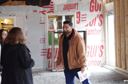 Fahim Mojawalla, owner of the Island Ship Center, describes to visitors the expansion going at his business, located at 1879 Whitehaven Road. 