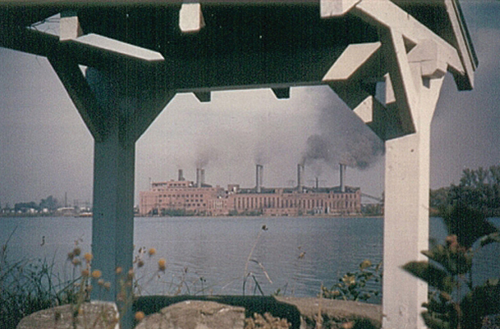 A glimpse of the River Lea well that was recovered earlier this year from the Niagara River at the edge of grounds of the historic mansion. In this photo, circa 1950, you can see the lower portion of the roof and part of the stone base of the well. The Huntley Plant in Tonawanda is seen across the river. (Photo from Grand Island Historical Society)