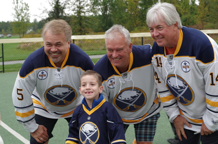 Sabres Alumni Craig Muni, Richie Dunn and Rene Robert signed autographs and posed for pictures with Miracle League players before taking the field. (Photo by Larry Austin)