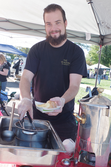 Jonathon Dudley serves up food at the Village Inn. (Photo by Larry Austin)