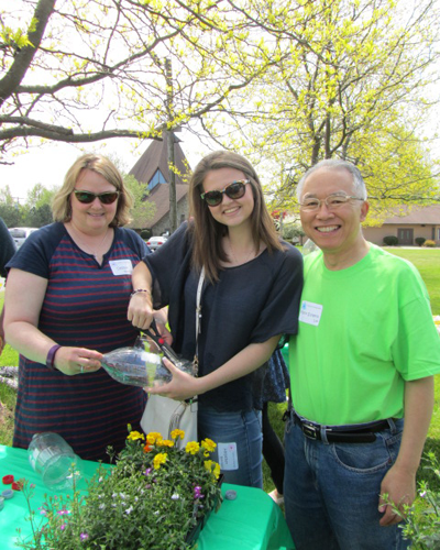 Debbie and Heather Robinson and Trinity United Methodist Church pastor the Rev. Dr. Sung Ho Lee.