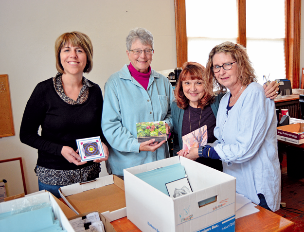 From left: Vice President of the Tonawandas' Council on the Arts Inc. Barbara Hughes, displays submitted artwork for the Art Off the Wall exhibition and fundraiser with local artists Linda Bannas, Joyce Hill and Cindi O'Mara.