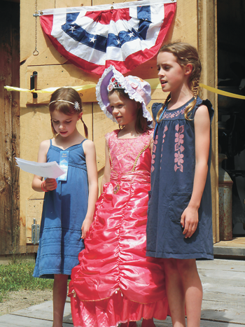 Granddaughters of the society's founder, Eugene Camann, recite a prayer at the Das Haus, Einhaus, und Der Stall German Heritage Museum's new Einhaus house-barn.