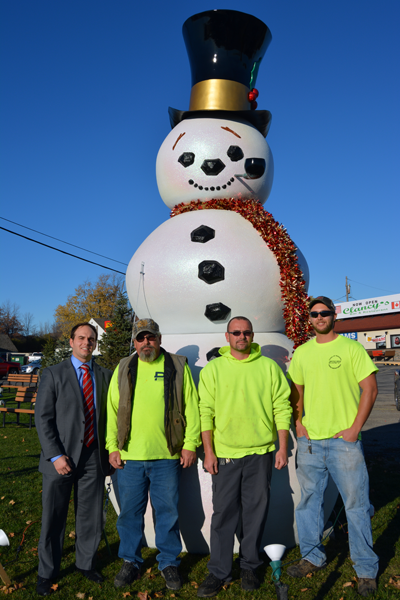 Members of the Town of Niagara's Highway Department assembled Frosty Niagara last week on Military Road. From left, are, Town of Niagara Business and Professional Association President Anthony L. Restaino, Jim Scalzo, Jim Scalzo Jr. and Dave Haseley of the Town of Niagara Highway Department.