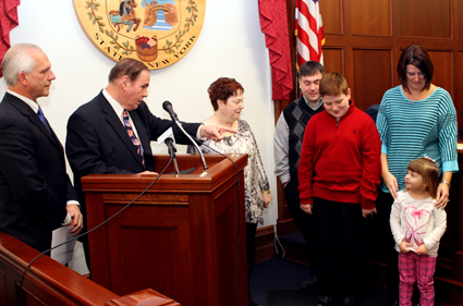 Niagara County Legislature Chairman Wm. Keith McNall teases granddaughter Madyson from the podium at the Niagara County Courthouse moments before taking his oath of office Tuesday in Lockport. McNall succeeds longtime Legislature Chairman William L. Ross, who left office at the end of 2015.