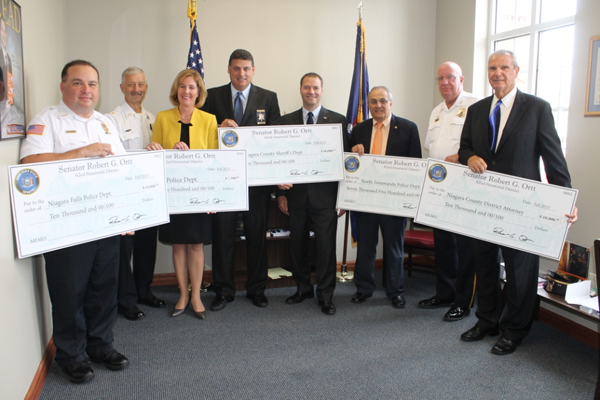 Pictured at Ortt's District Office, from left: Niagara Falls Police Superintendent Bryan DalPorto, Lockport Police Chief Larry Eggert, Lockport Mayor Anne McCaffrey, Niagara County Sheriff James Voutour, Ortt, North Tonawanda Mayor Art Pappas, North Tonawanda Police Chief William Hal; and Niagara County District Attorney Michael Violante.