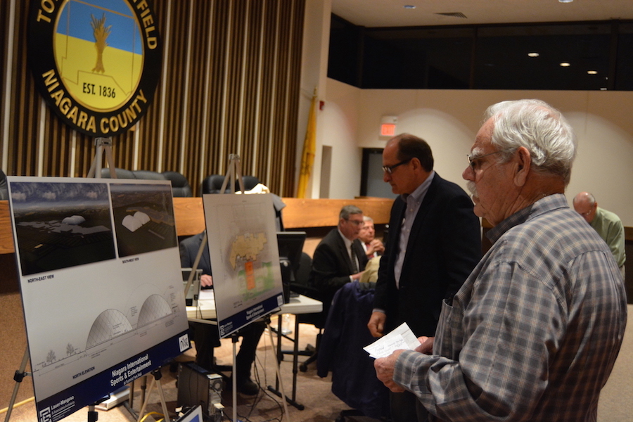 Wheatfield resident Bob Federspiel studies the new site plan for the proposed Niagara International Sports and Entertainment facility at The Summit mall.