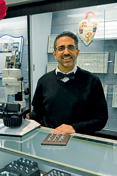 Thomas Laurrie displays some of the engagement rings available at Firth Jewelers. Laurrie was named Business Person of the Year.