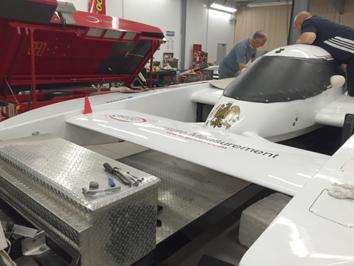 People work on a hydroplane at a workshop at GP:50/Blue Ribbon, owned by Don Less, on Grand Island. Less is a major sponsor of the boat. (Contributed photo)