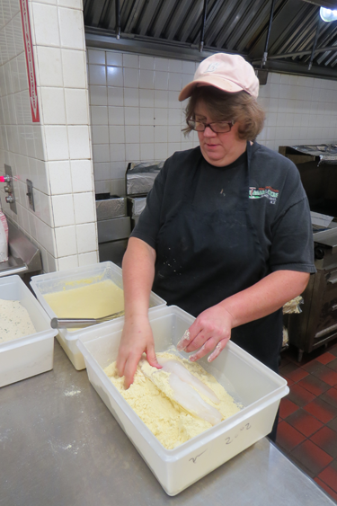 Linda Brown is shown preparing her winning fish fry.