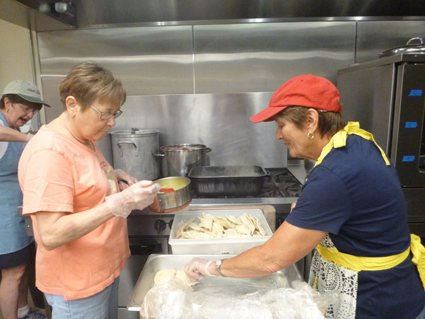 Laura Stockburger and Judy Smolka prepare pierogi at the kitchen at the Our Lady of Czestochowa parish hall in North Tonawanda.