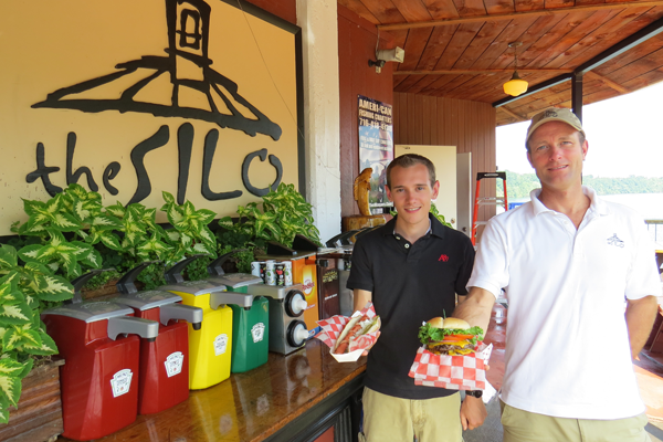 Tyler Seelbinder and Alan Hastings pose with a hot dog and hamburger.