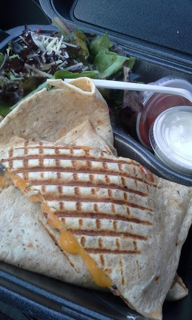 The "Wedgie" sandwich ($9.95) served with a small side salad, sour cream and salsa.