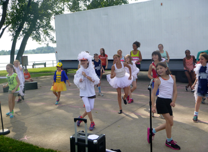 Young actors and actresses dance during a rehearsal for 
