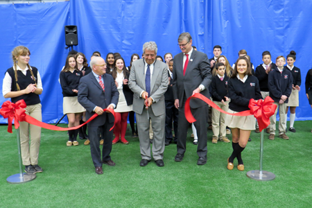 Students look on as the ceremony unfolds and the ribbon is cut.