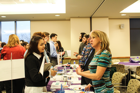 NU student Malika-Budur Kalila listens to Judie Glaser, public relations coordinator at the Niagara Falls City School District.